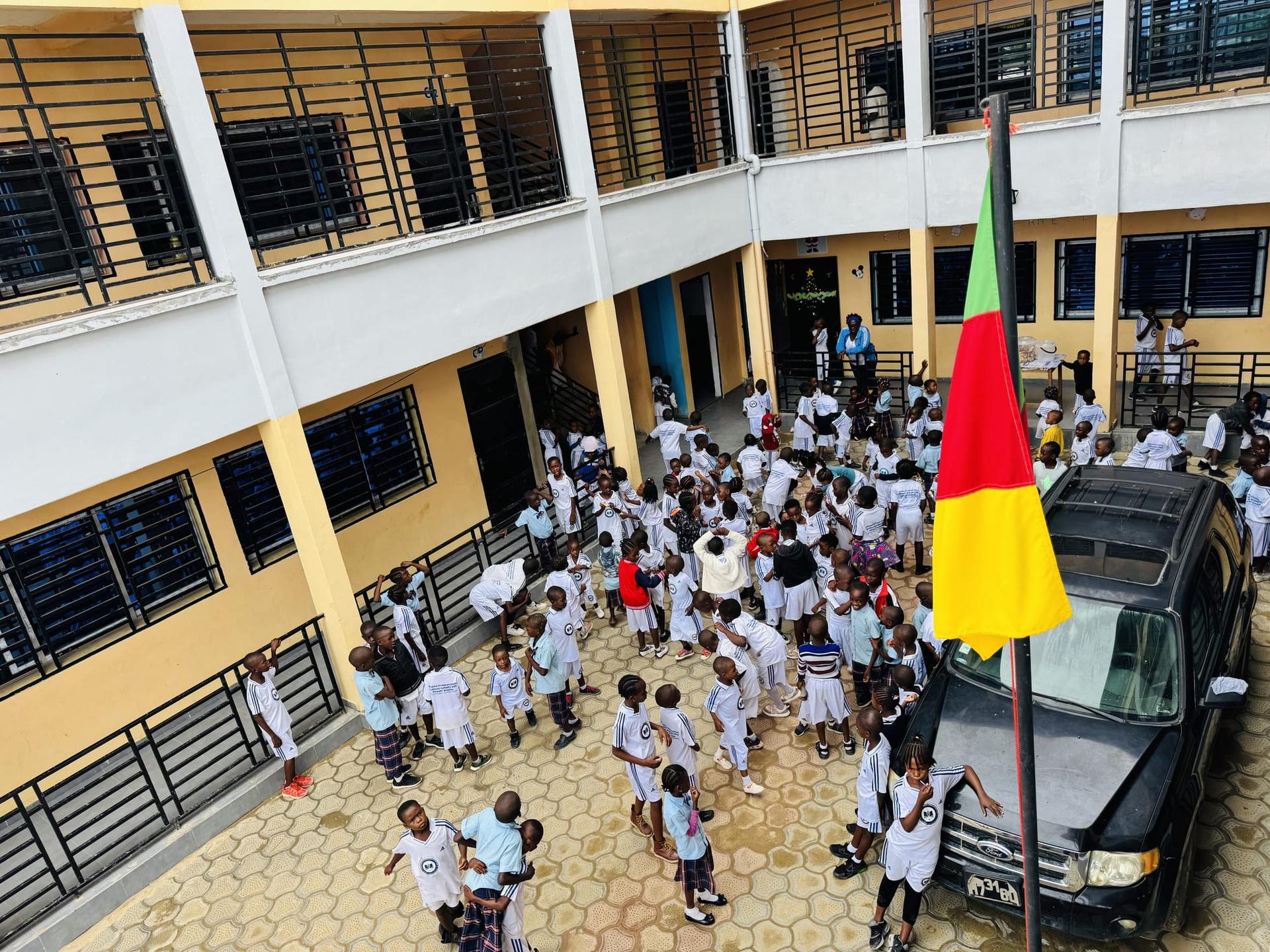 Primary pupils in the school courtyard at Dunamis